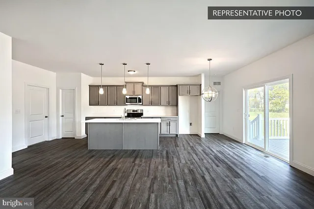 a view of kitchen with wooden floor