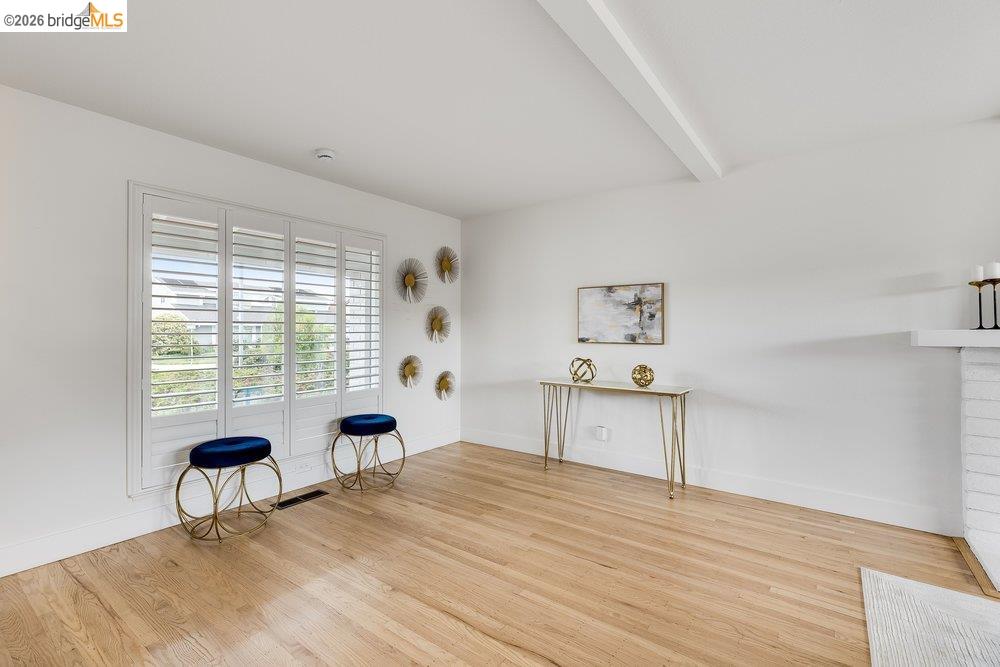 1298 Ribbon Street Foster City, CA 94404 - Photo 19 of 86 Hardwood flooring complements the bright white walls and ceiling beam