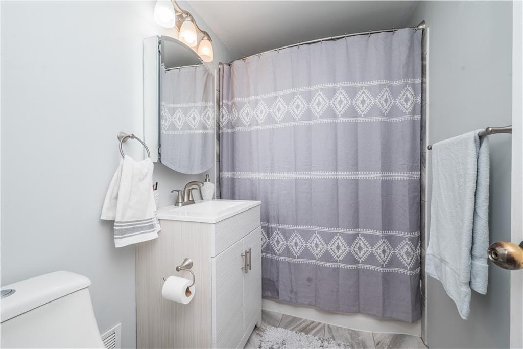 4915 Brownsville Road Pittsburgh, PA 15236 - Photo 13 of 21 a bathroom with a sink a toilet and shower