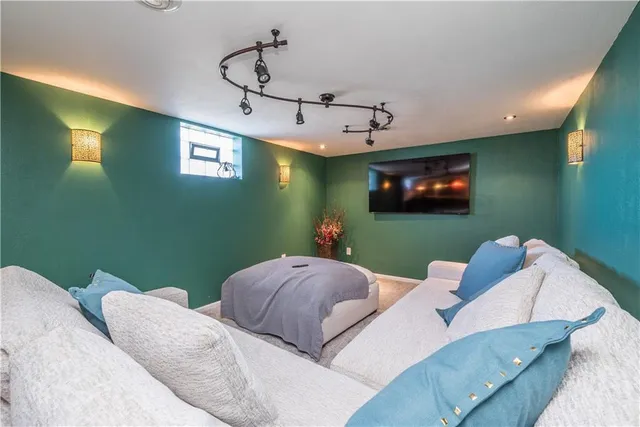 a bed room with two bed and a flat screen tv