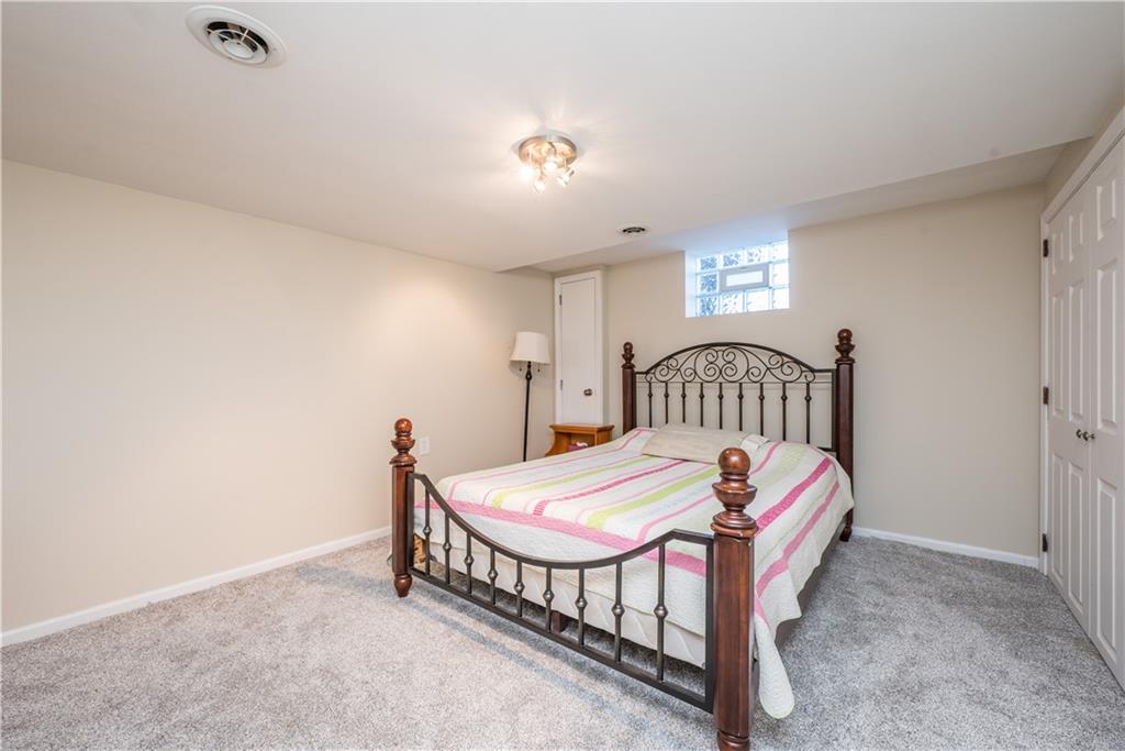 4915 Brownsville Road Pittsburgh, PA 15236 - Photo 16 of 21 a bedroom with a bed and a table