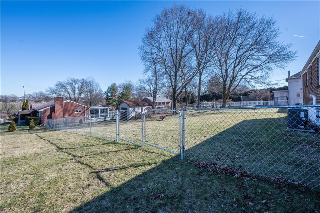 4915 Brownsville Road Pittsburgh, PA 15236 - Photo 21 of 21 a backyard of apartments with large trees