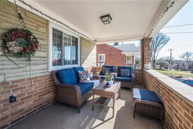 a outdoor living space with patio furniture and a potted plant