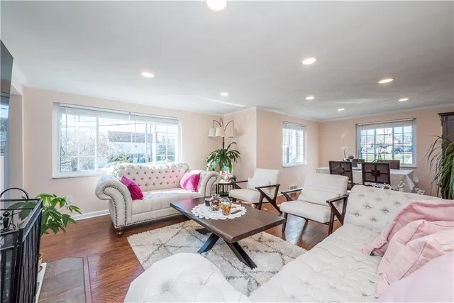 a living room with furniture or window and a wooden floor