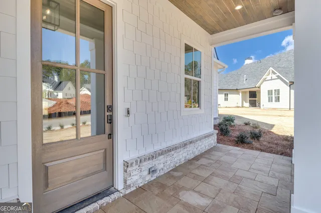 a view of a hallway with wooden shelves