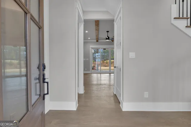 a large kitchen with stainless steel appliances granite countertop a sink and a large window