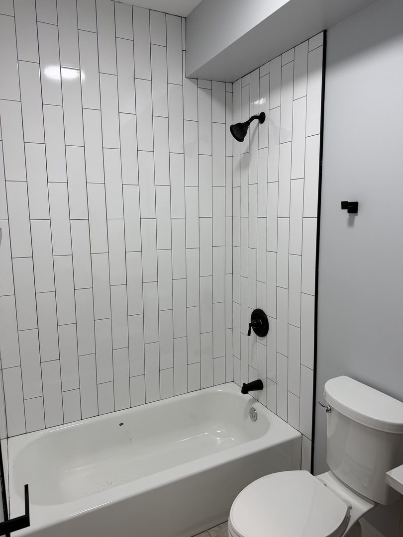 2622 West Adams Street, Unit 2 Chicago, IL 60612 - Photo 19 of 26 a bathroom with a toilet and a shower