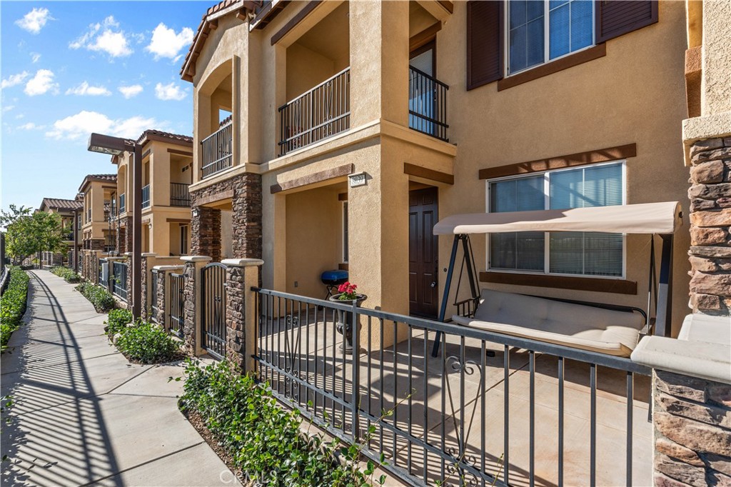 8039 City View Place Rancho Cucamonga, CA 91730 - Photo 1 of 39 a front view of a building with glass windows and stairs