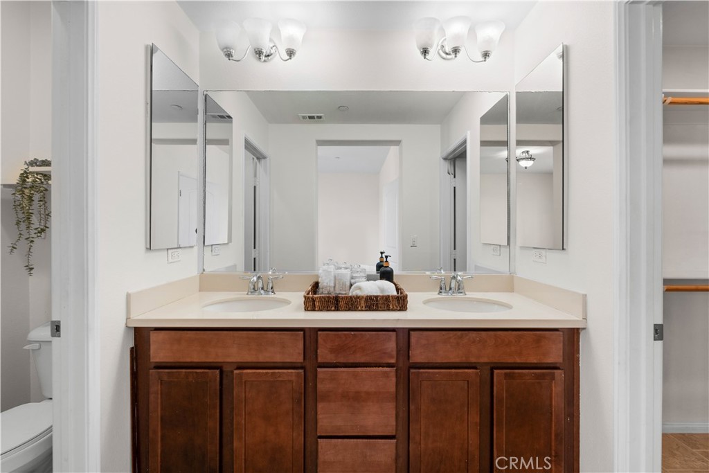 8039 City View Place Rancho Cucamonga, CA 91730 - Photo 16 of 39 a bathroom with a double vanity sink and a mirror