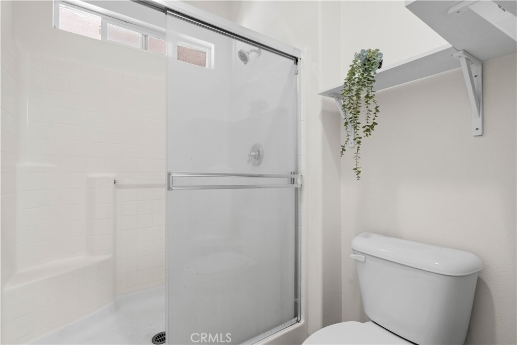 8039 City View Place Rancho Cucamonga, CA 91730 - Photo 18 of 39 a bathroom with a shower and a toilet