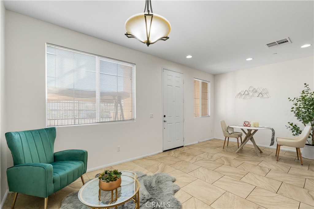 8039 City View Place Rancho Cucamonga, CA 91730 - Photo 4 of 39 a living room with furniture and a chandelier