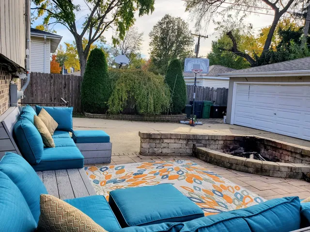 a view of backyard with outdoor seating