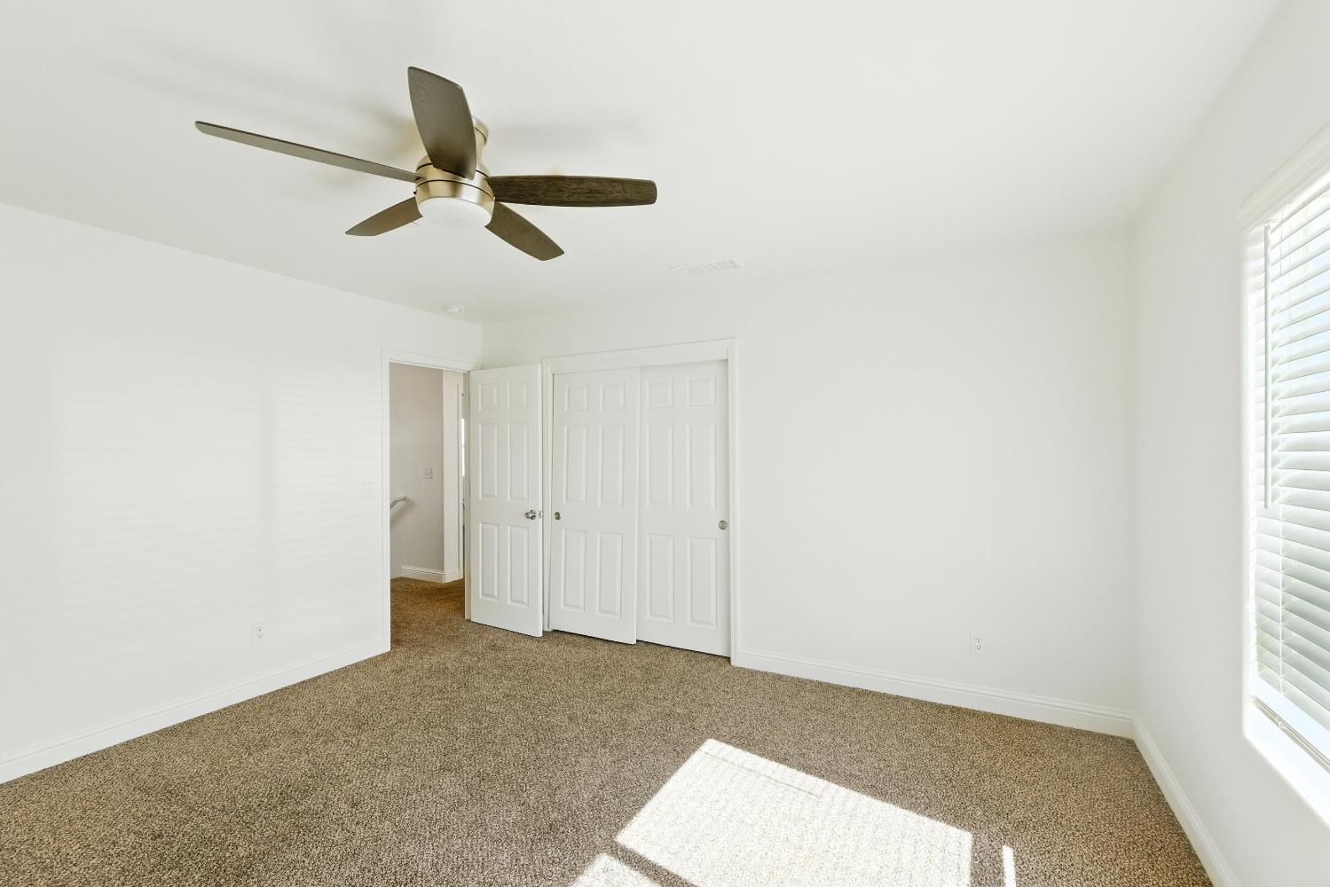 1732 Cleveland Street Selma, CA 93662 - Photo 11 of 24 a view of a livingroom with a ceiling fan and window