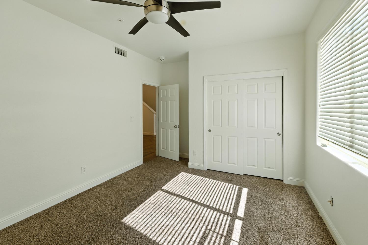 1732 Cleveland Street Selma, CA 93662 - Photo 12 of 24 an empty room with closet and windows