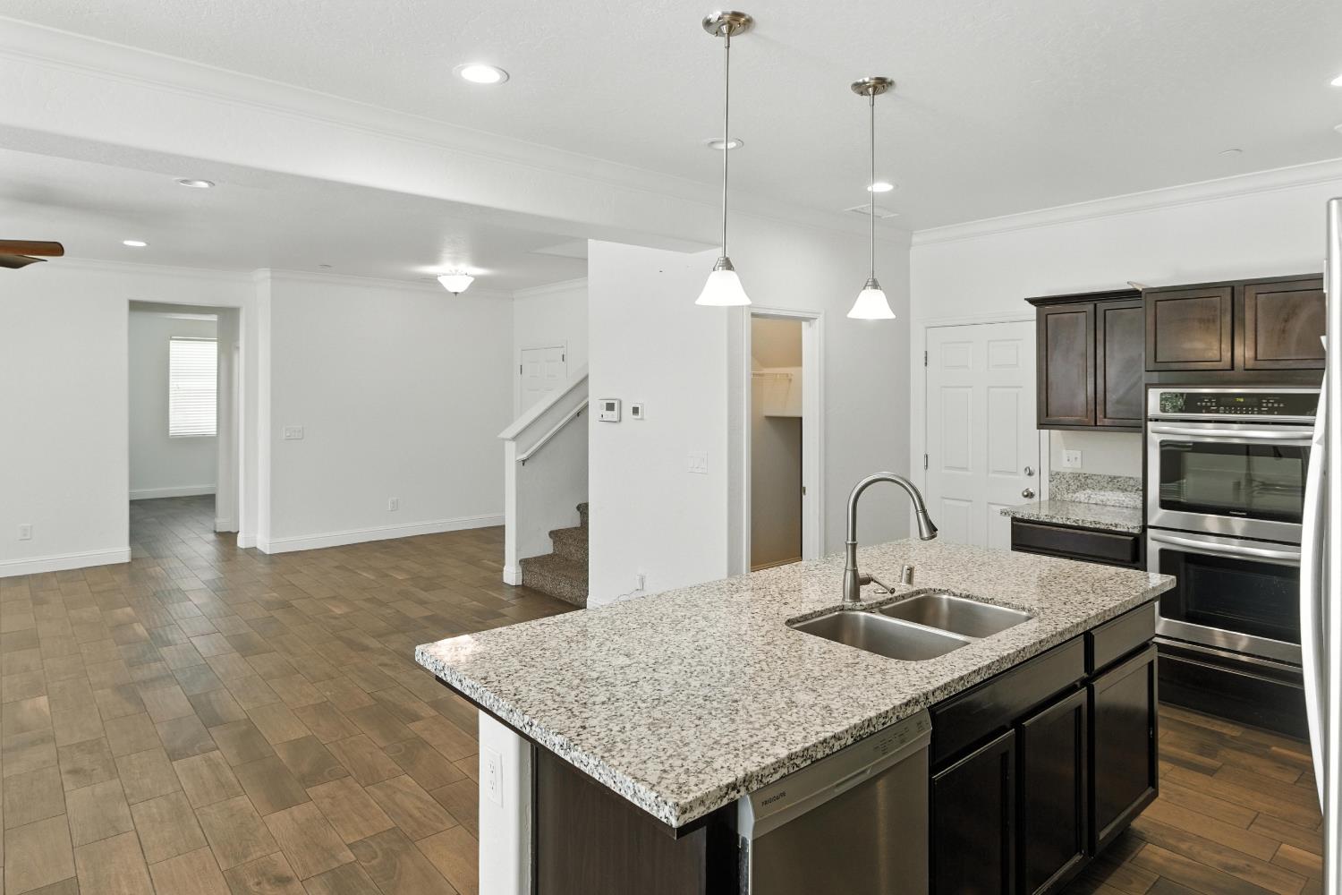 1732 Cleveland Street Selma, CA 93662 - Photo 4 of 24 a kitchen with a sink a counter space appliances and cabinets