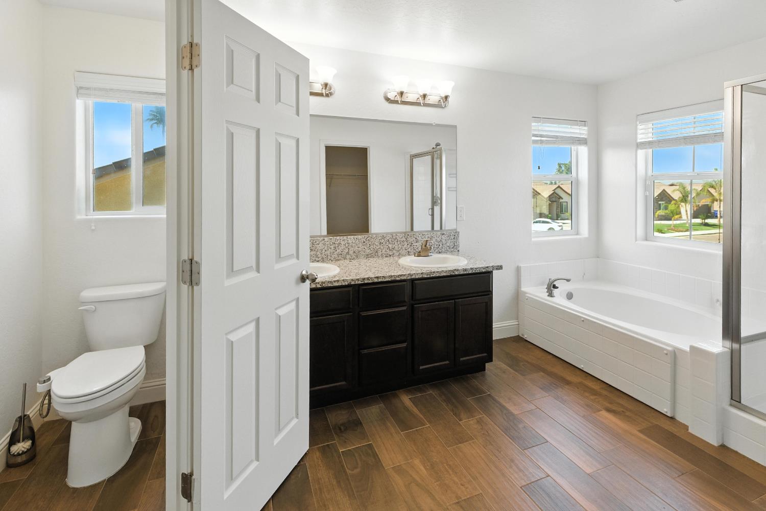 1732 Cleveland Street Selma, CA 93662 - Photo 8 of 24 a spacious bathroom with a tub sink toilet and mirror