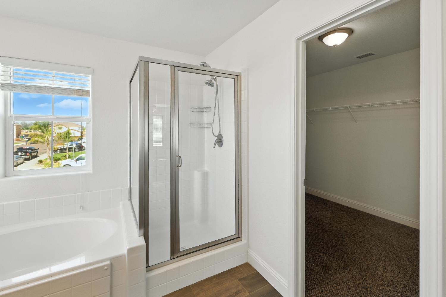 1732 Cleveland Street Selma, CA 93662 - Photo 9 of 24 a bathroom with a bathtub and a shower