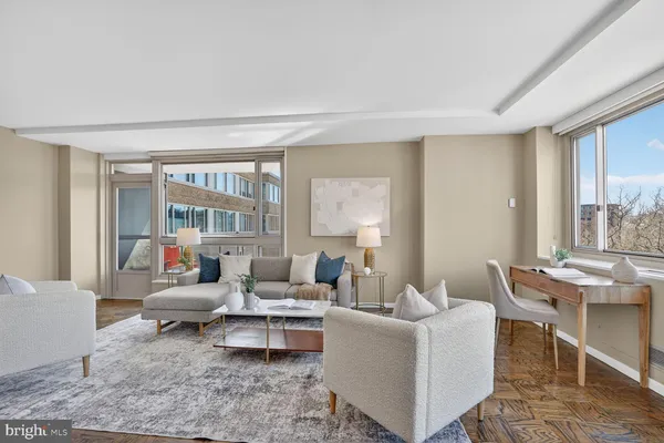 a living room with furniture and a large window