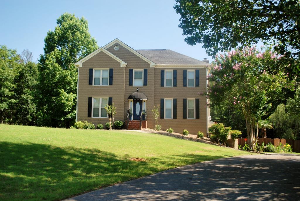 Beautiful two story home over partial finished basement and drive under garage.