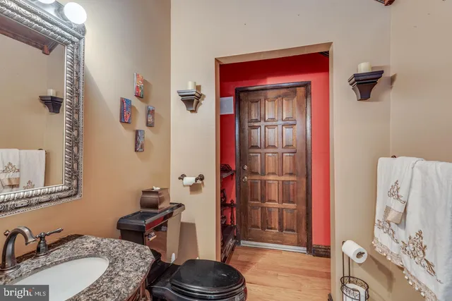 a view of a hallway with a furniture and entryway