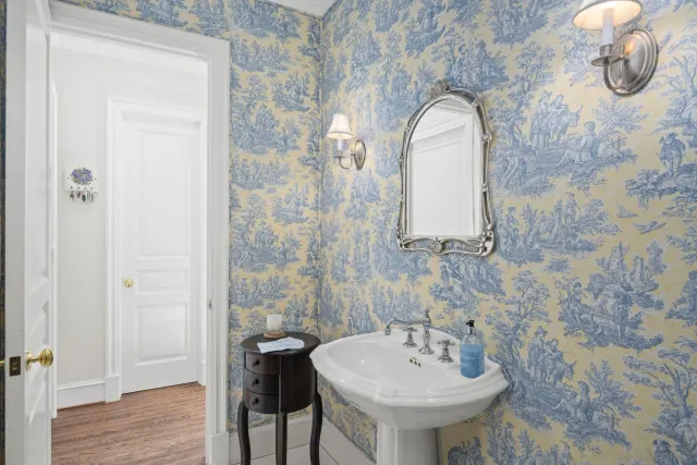 a bathroom with a sink a mirror and a shower