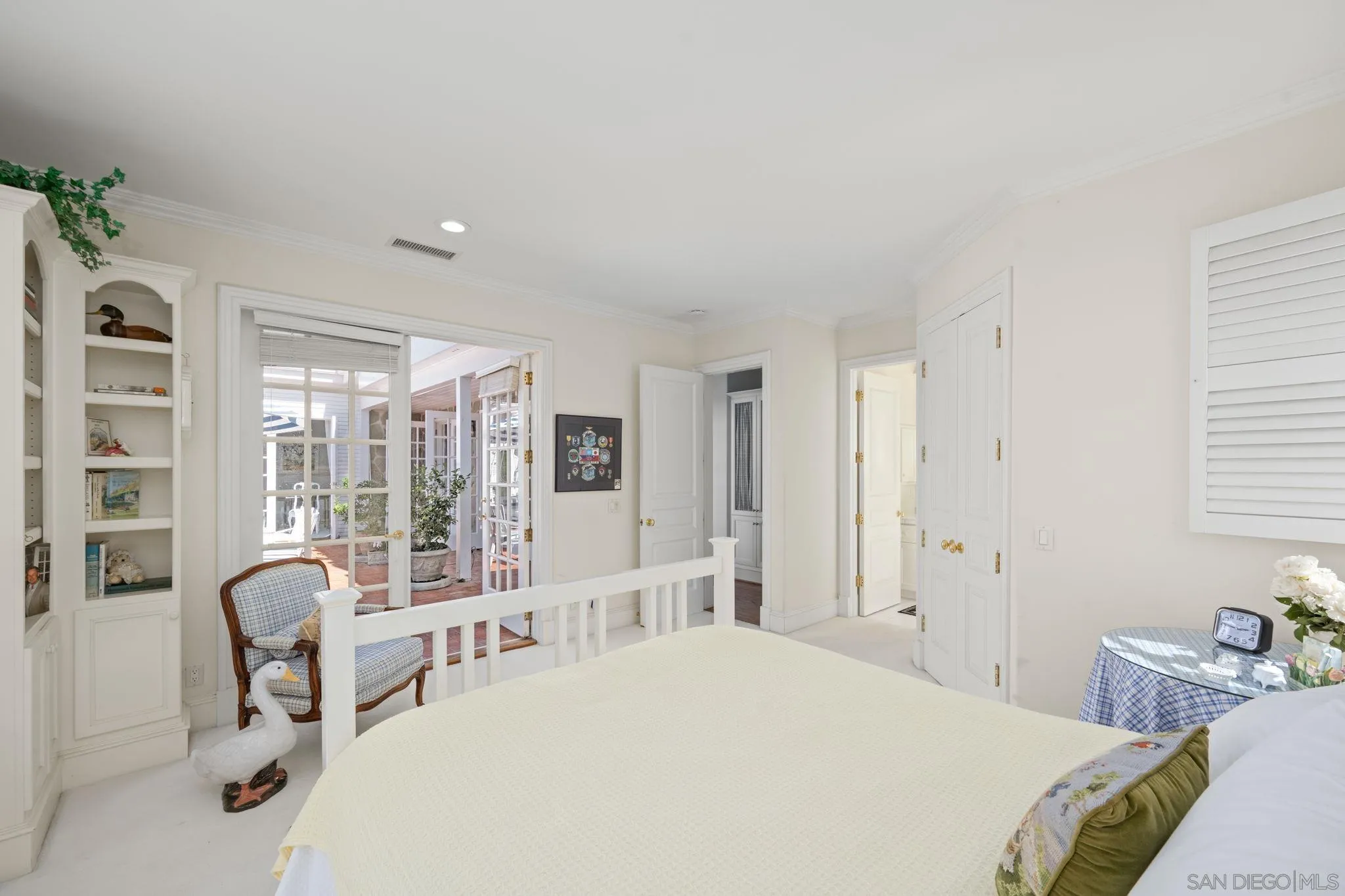 5618 Loma Verde Drive Rancho Santa Fe, CA 92067 - Photo 21 of 39 a bedroom with a bed and a large window