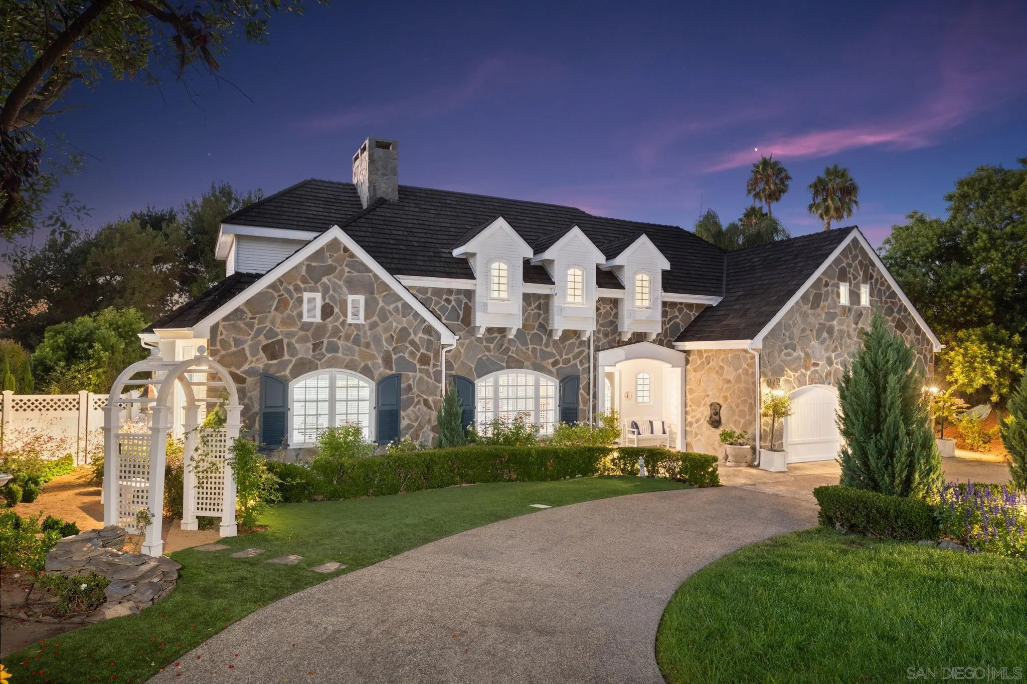 5618 Loma Verde Drive Rancho Santa Fe, CA 92067 - Photo 3 of 39 a front view of a house with a yard