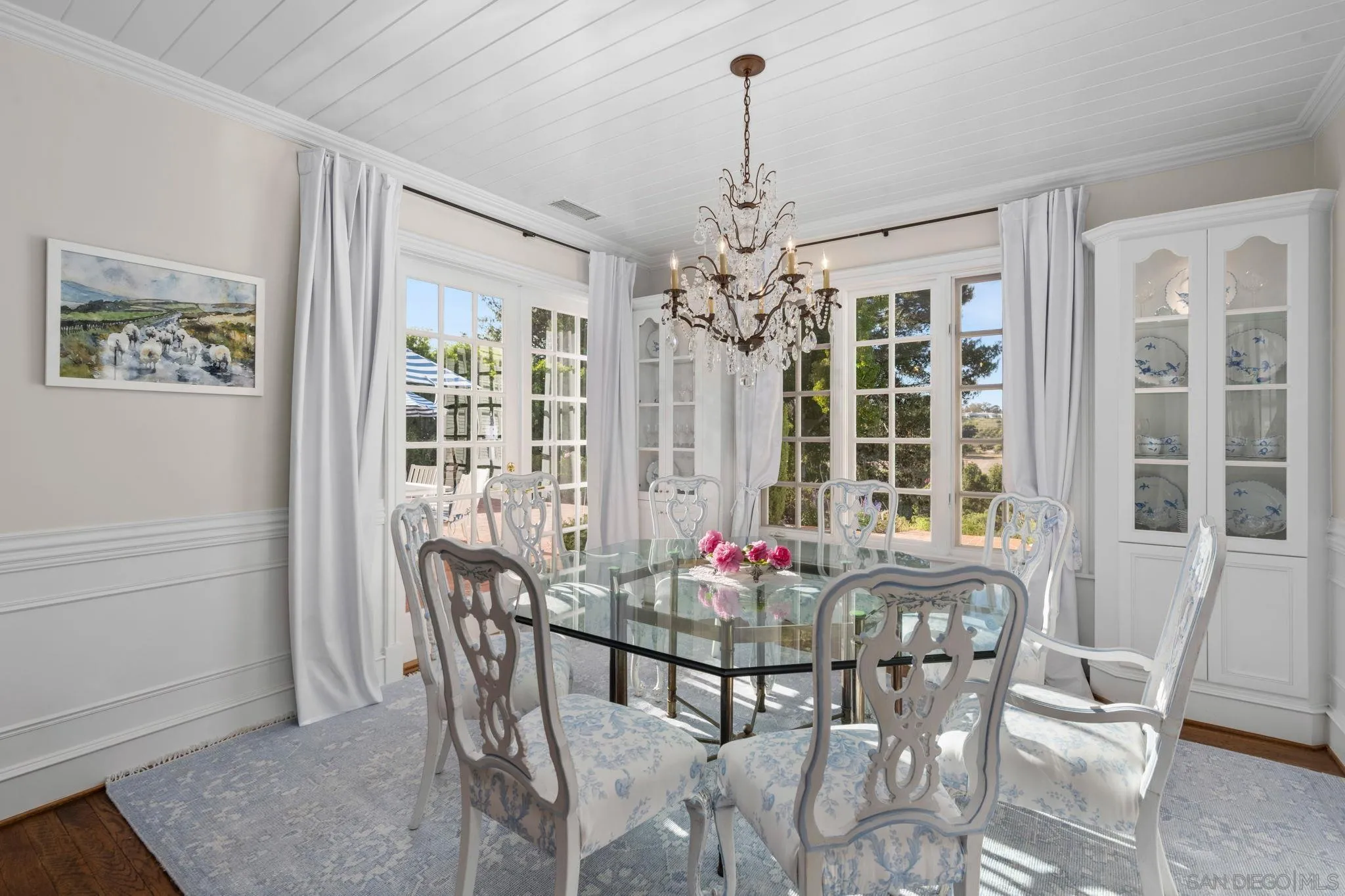 5618 Loma Verde Drive Rancho Santa Fe, CA 92067 - Photo 36 of 39 a view of a dining room with furniture and chandelier