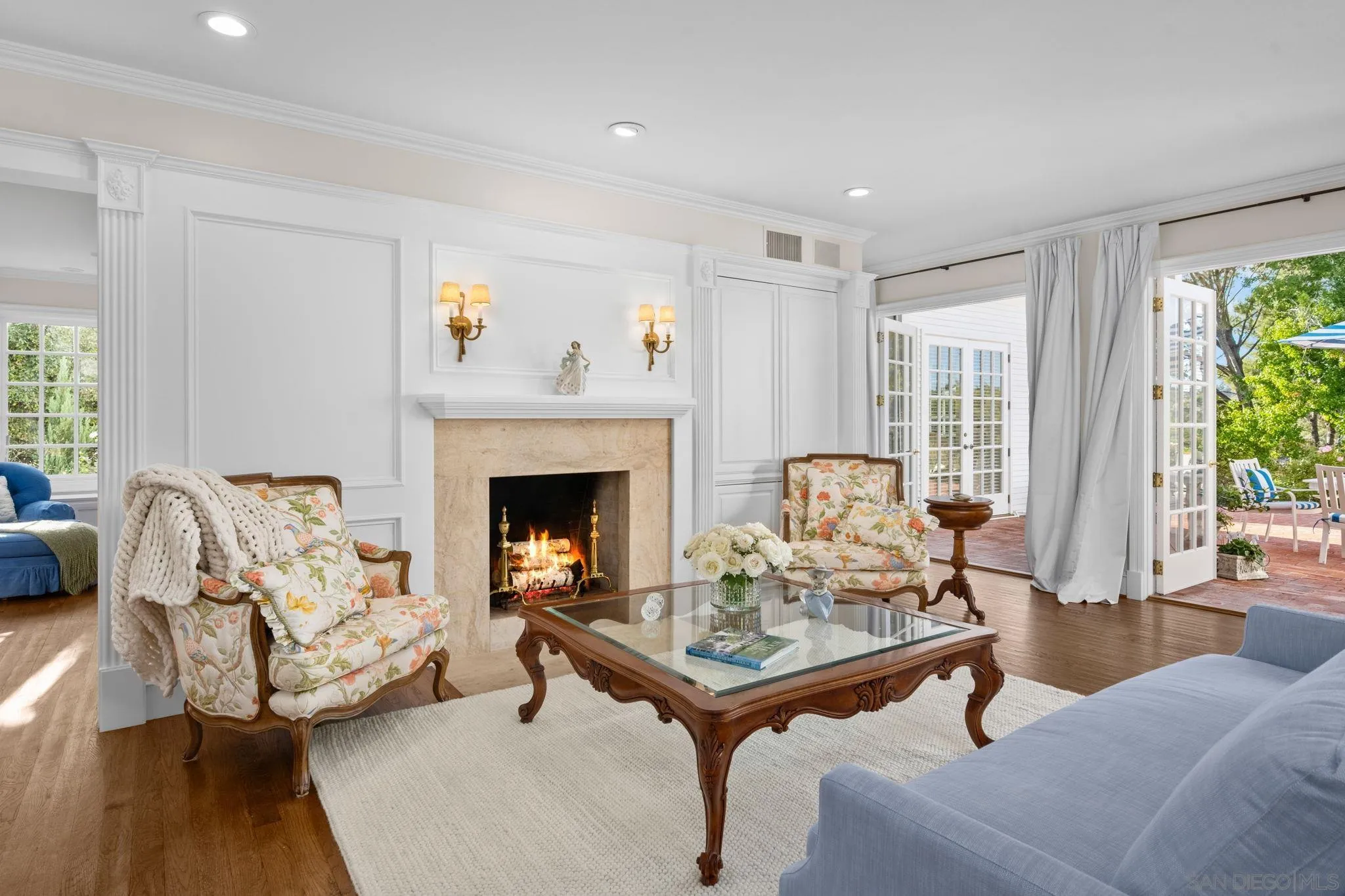 5618 Loma Verde Drive Rancho Santa Fe, CA 92067 - Photo 37 of 39 a living room with furniture and a fireplace