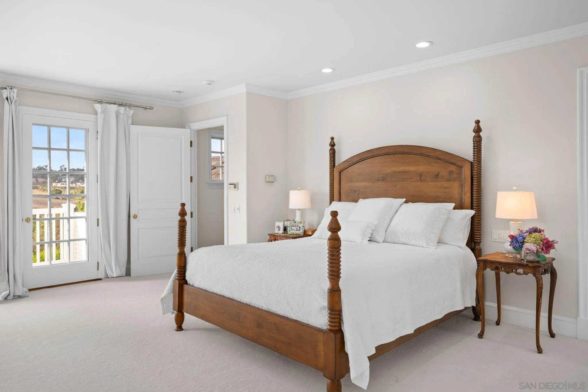 5618 Loma Verde Drive Rancho Santa Fe, CA 92067 - Photo 38 of 39 a bedroom with a bed and a lamp