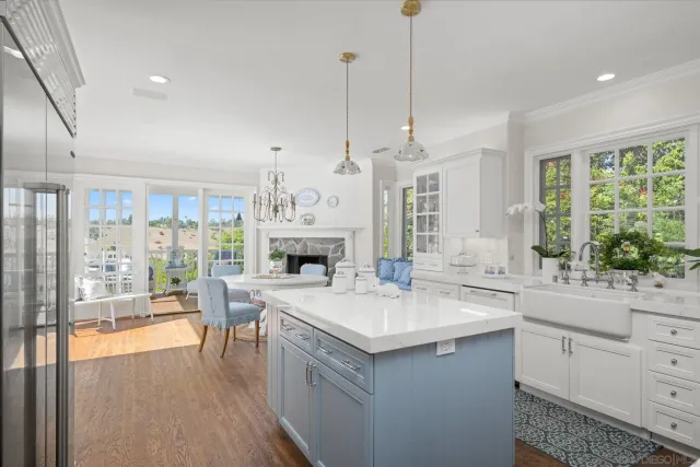 a open kitchen with sink and dishwasher with wooden floor