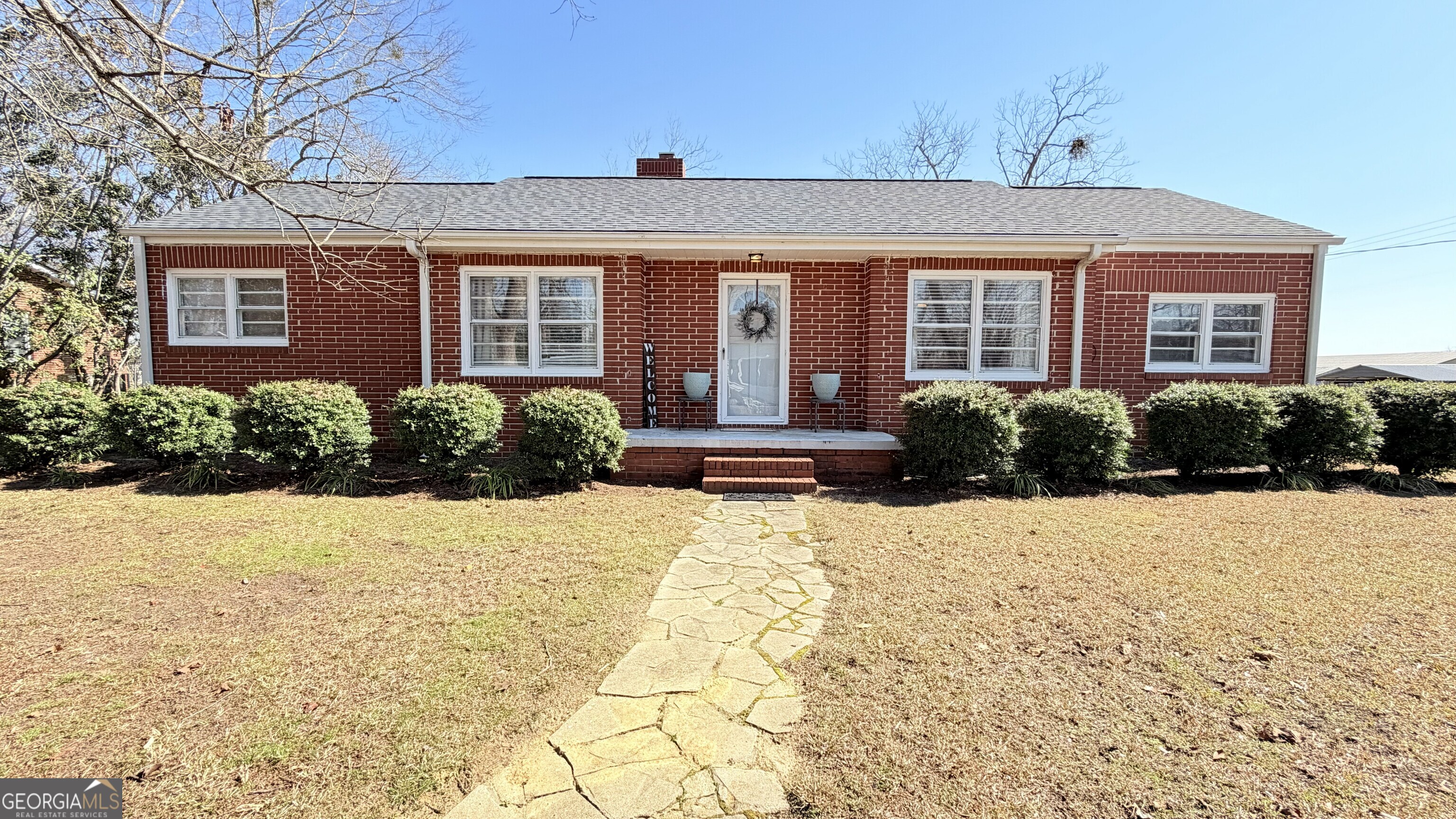 1328 1st Street Dudley, GA 31022 - Photo 1 of 1 a front view of a house with a yard