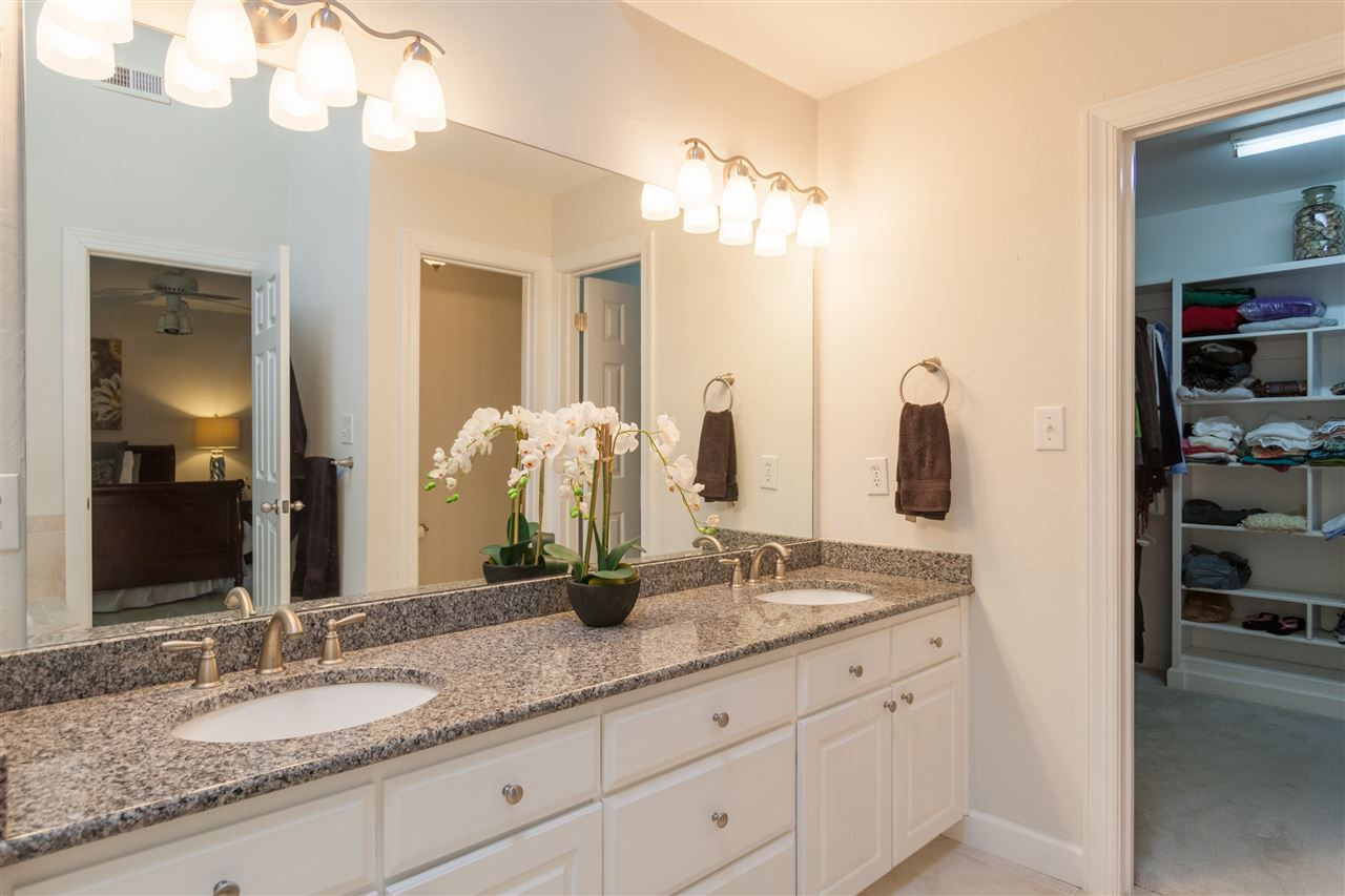 4124 Ridgebrook Bluffs Drive Raleigh, NC 27603 - Photo 13 of 24 Updated bath with granite, double sinks and large walk-in wardrobe. Neutral paint, tile & fixtures. Master Bedroom