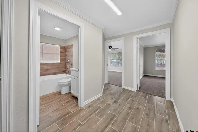 a kitchen with stainless steel appliances kitchen island granite countertop a sink and cabinets