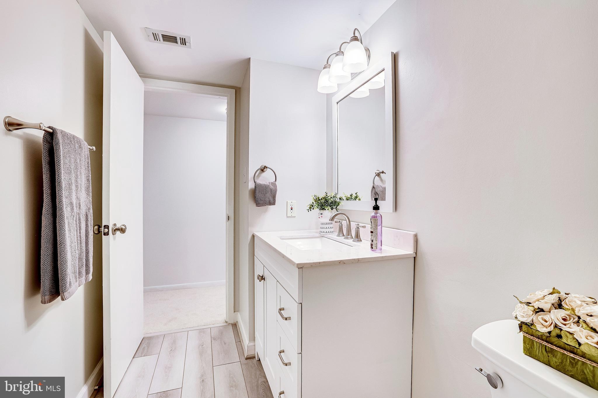 1556 Northgate Square, Unit 22B Reston, VA 20190 - Photo 11 of 34 New vanity and countertop, lighting, flooring