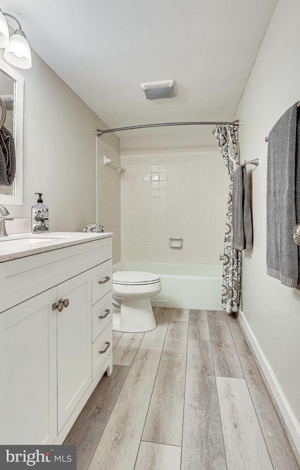 1556 Northgate Square, Unit 22B Reston, VA 20190 - Photo 12 of 34 New flooring in spacious bathroom