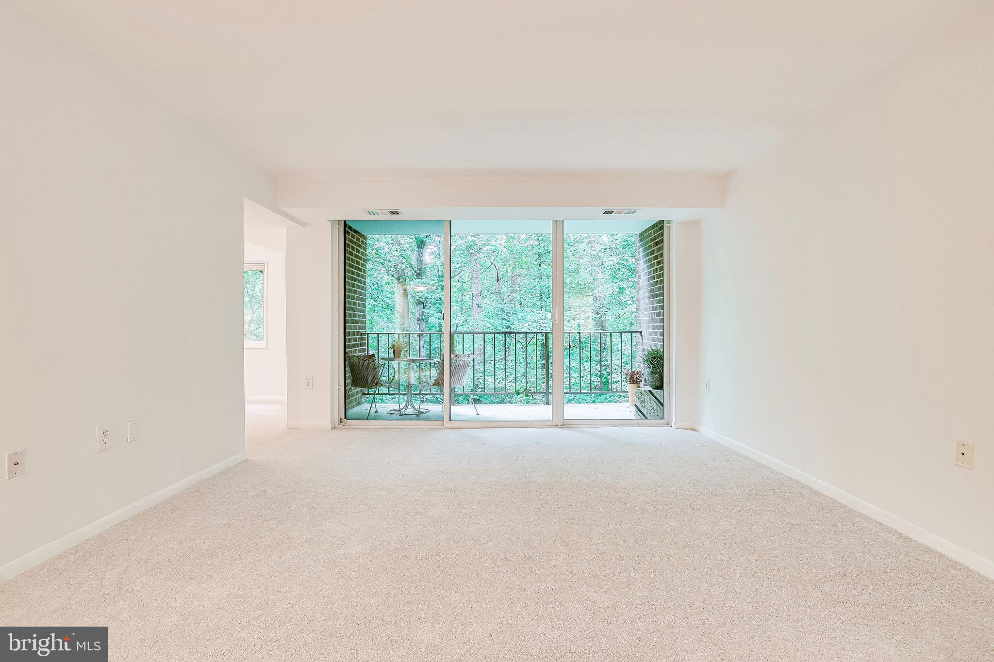 1556 Northgate Square, Unit 22B Reston, VA 20190 - Photo 13 of 34 Large open living room with new paint, flooring