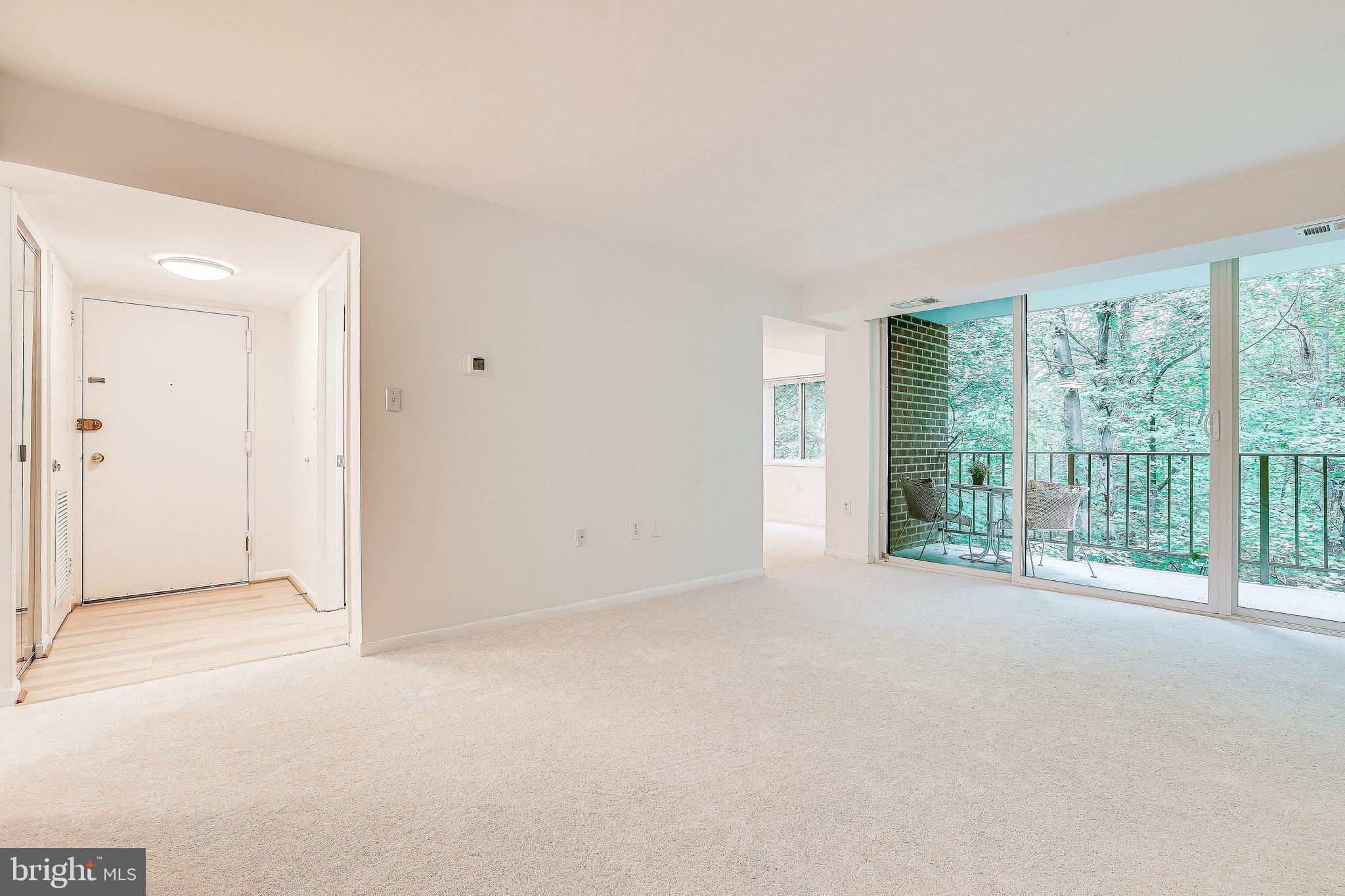1556 Northgate Square, Unit 22B Reston, VA 20190 - Photo 14 of 34 Living room with access to private balcony