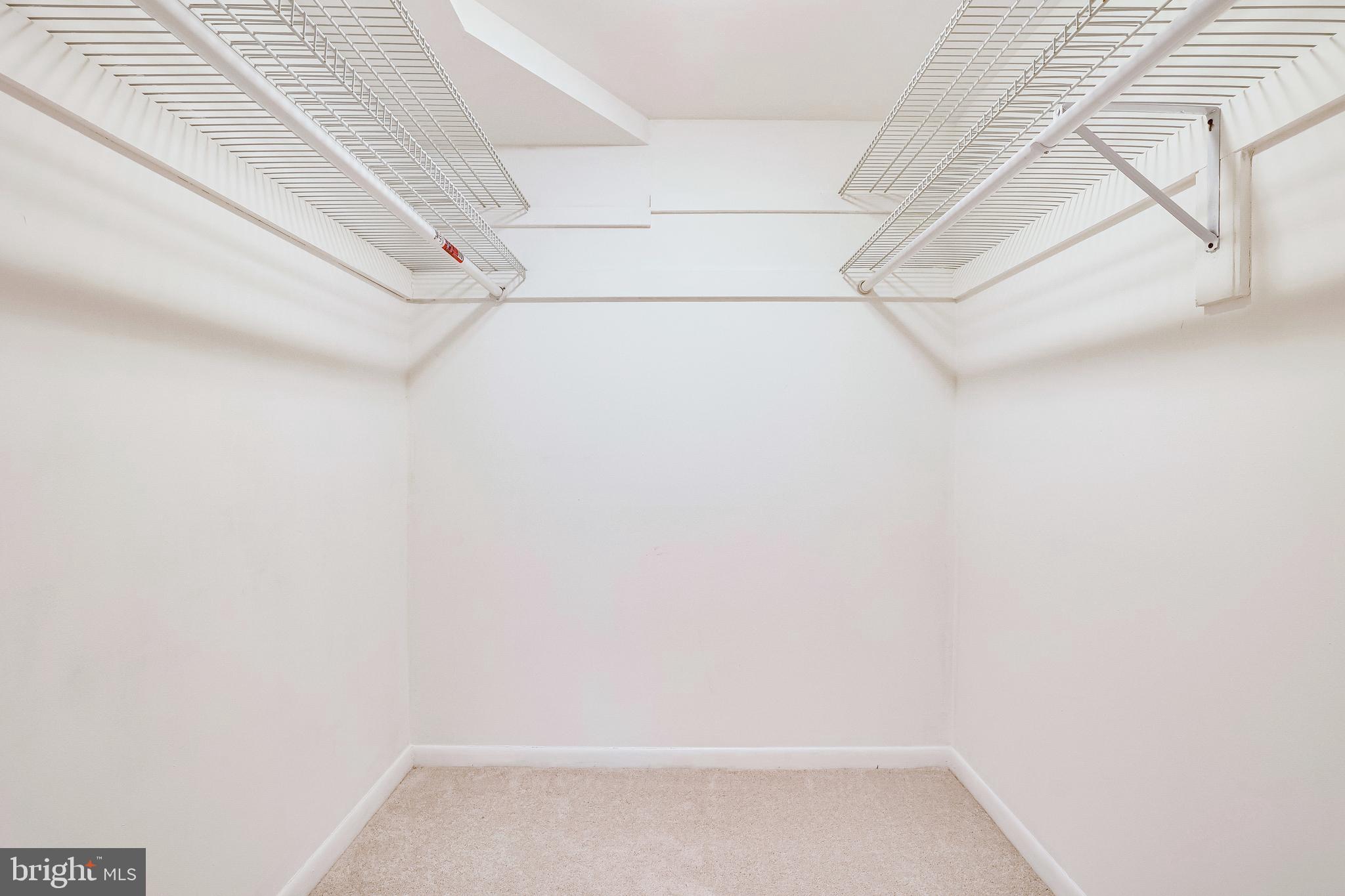 1556 Northgate Square, Unit 22B Reston, VA 20190 - Photo 22 of 34 Large walk-in closet in primary bedroom