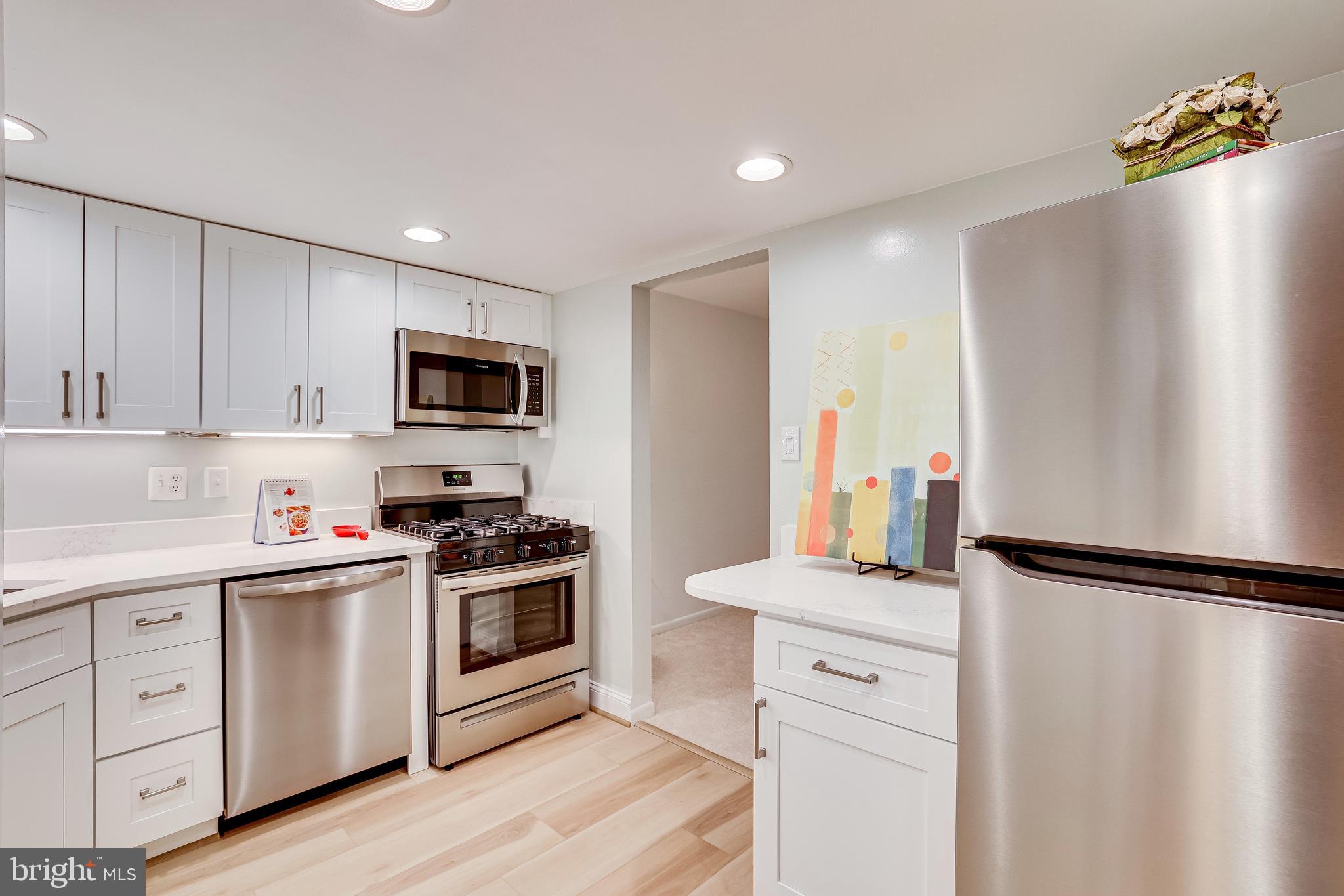 1556 Northgate Square, Unit 22B Reston, VA 20190 - Photo 4 of 34 Bright and beautifully remodeled kitchen
