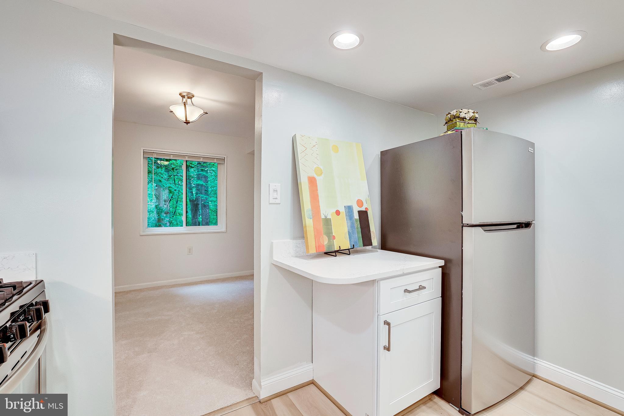 1556 Northgate Square, Unit 22B Reston, VA 20190 - Photo 8 of 34 Counter area for bar stool, access to dining room