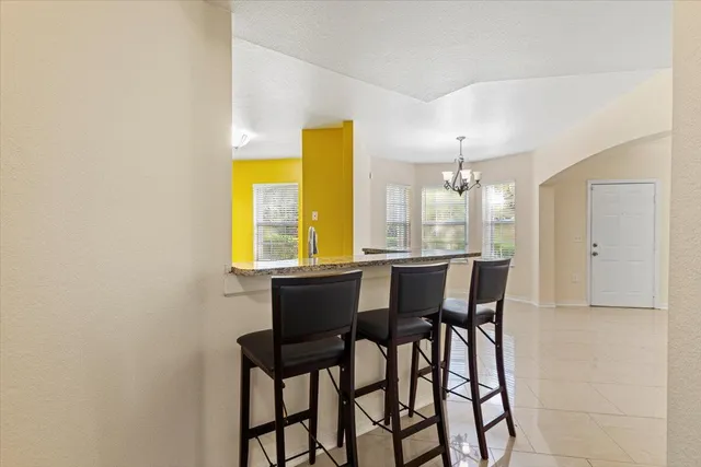 a kitchen with stainless steel appliances granite countertop a sink and a stove