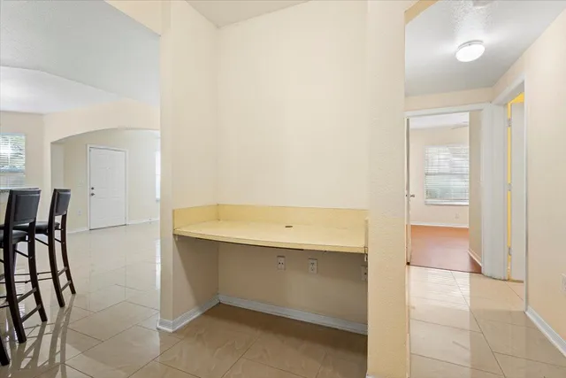 a kitchen with a stove a sink and a microwave