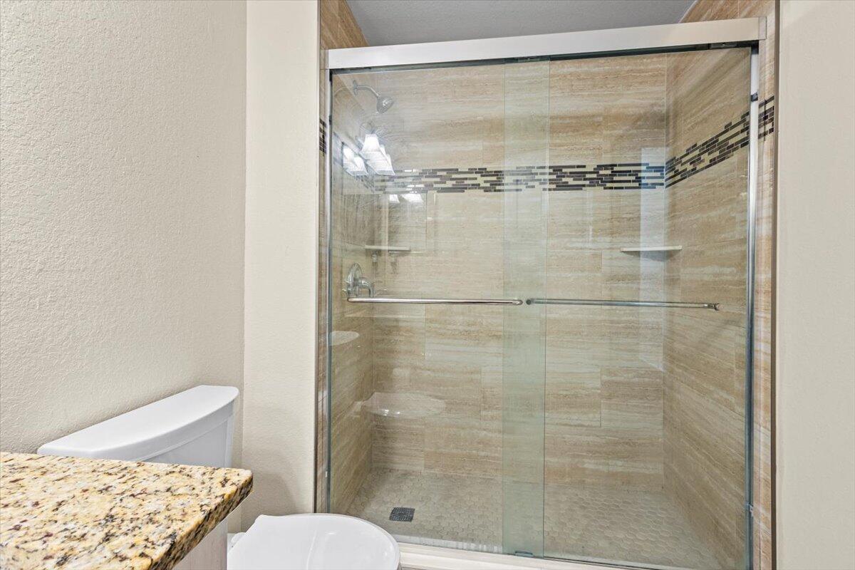 110 Southwest Peacock Boulevard, Unit 6101 Port St. Lucie, FL 34986 - Photo 42 of 70 a bathroom with a shower