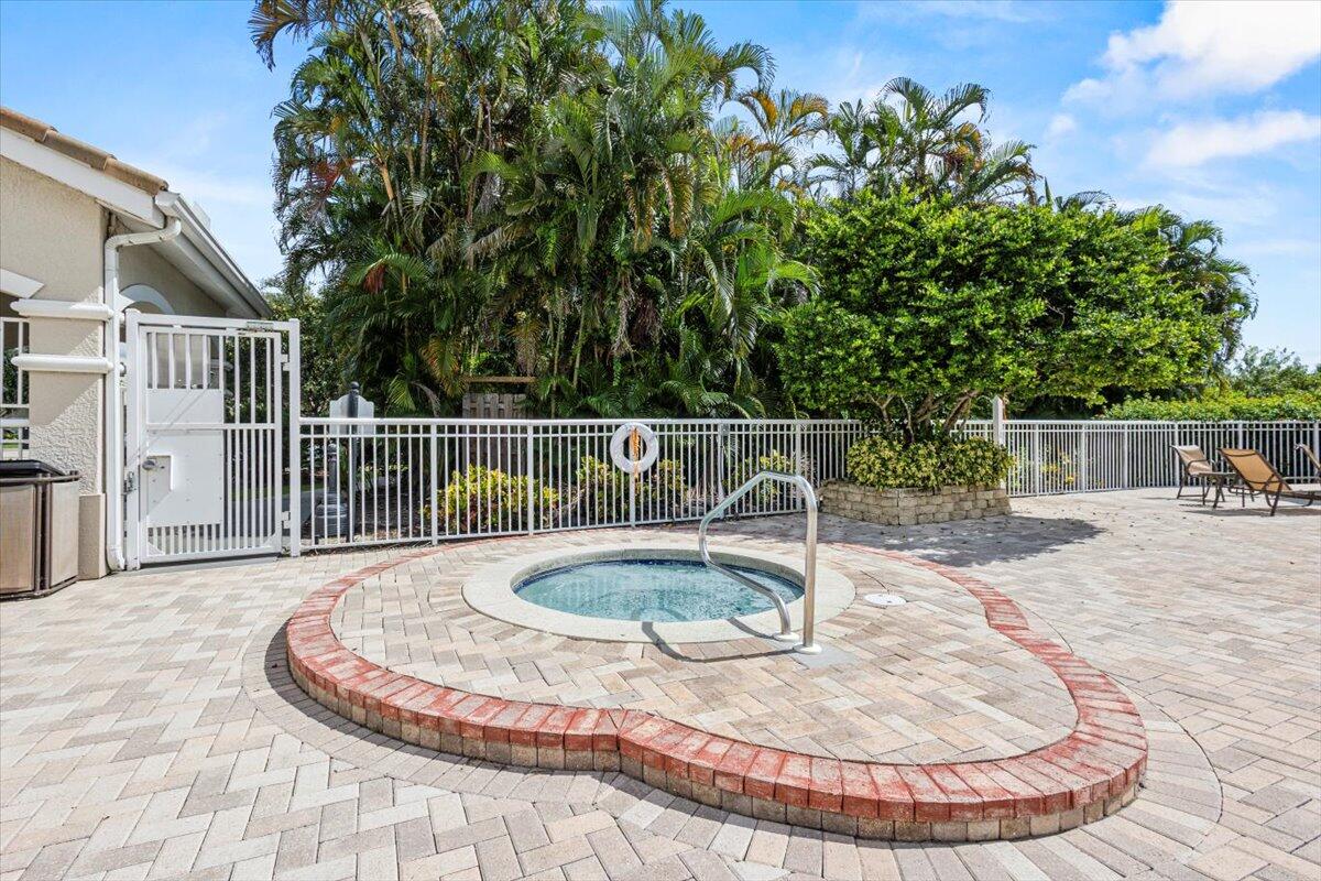 110 Southwest Peacock Boulevard, Unit 6101 Port St. Lucie, FL 34986 - Photo 49 of 70 a view of a swimming pool with a sitting space