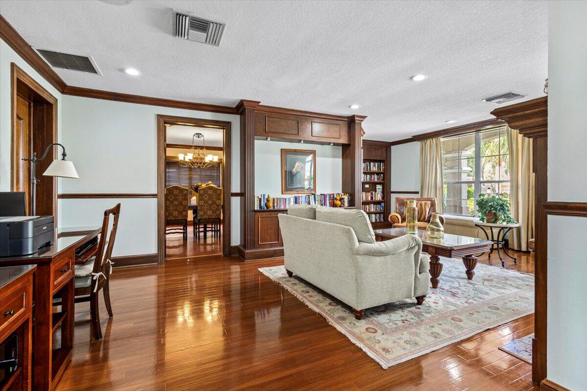110 Southwest Peacock Boulevard, Unit 6101 Port St. Lucie, FL 34986 - Photo 53 of 70 a living room with furniture and a wooden floor