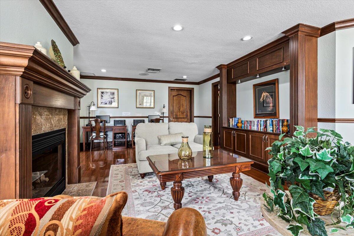 110 Southwest Peacock Boulevard, Unit 6101 Port St. Lucie, FL 34986 - Photo 55 of 70 a living room with furniture and a potted plant