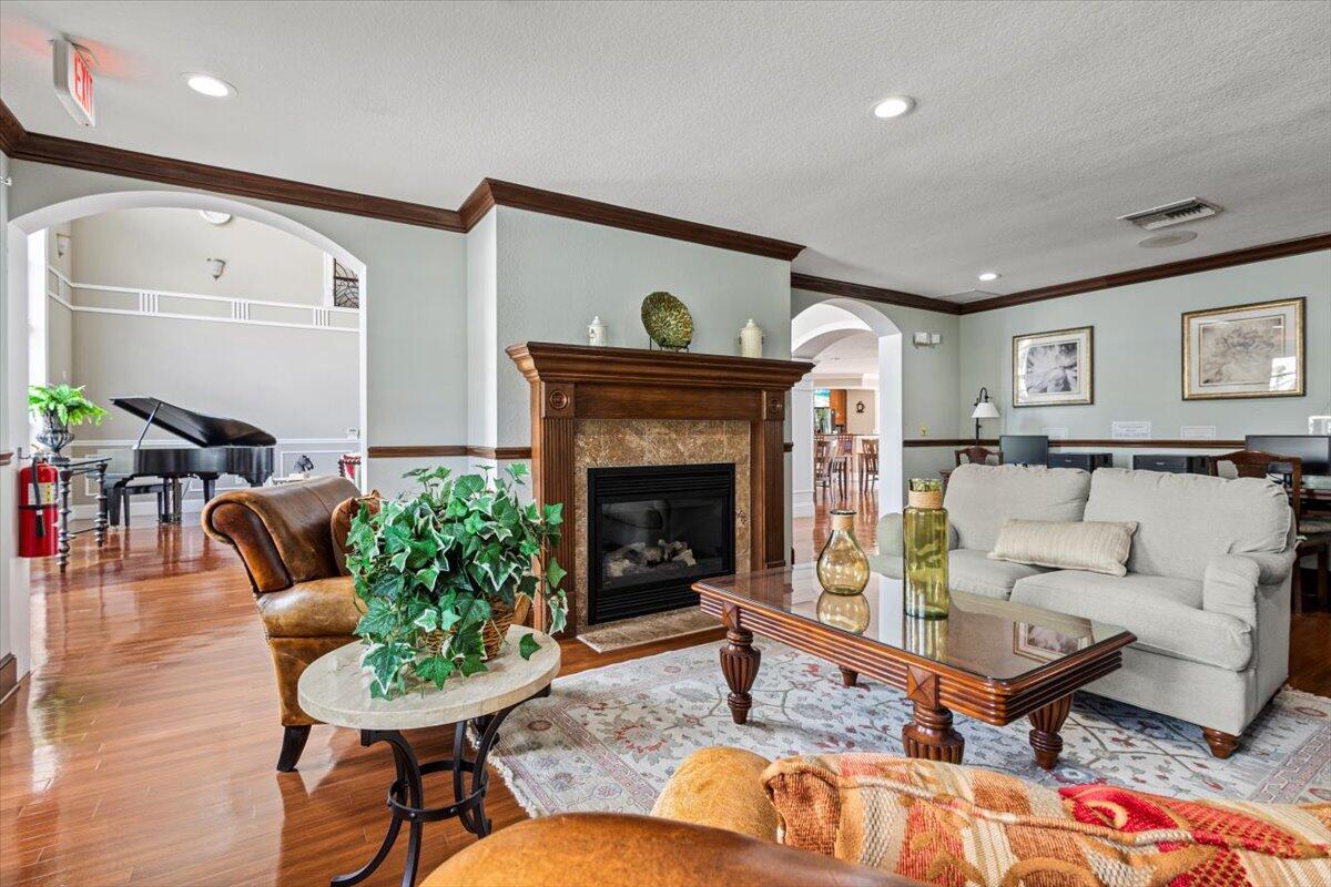 110 Southwest Peacock Boulevard, Unit 6101 Port St. Lucie, FL 34986 - Photo 56 of 70 a living room with furniture and a fireplace