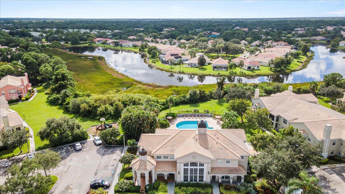110 Southwest Peacock Boulevard, Unit 6101 Port St. Lucie, FL 34986 - Photo 68 of 70 an aerial view of residential houses with outdoor space and river view