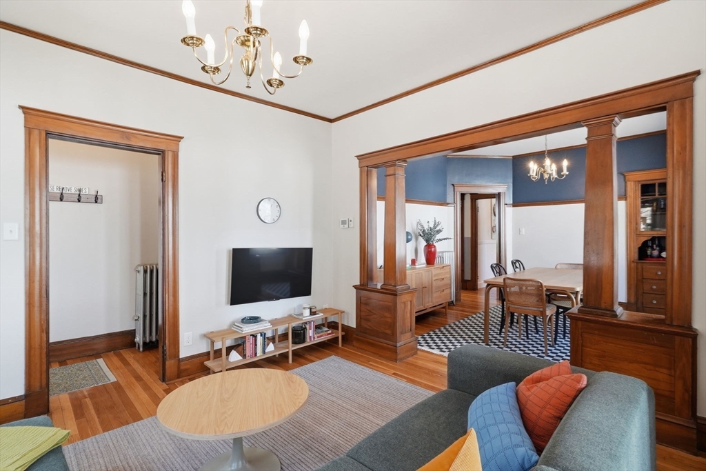 42 Lagrange Street, Unit U1 Boston, MA 02132 - Photo 11 of 42 a living room with furniture and a flat screen tv